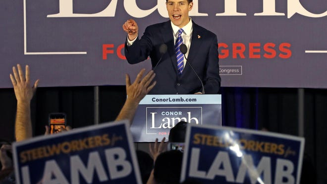 FILE - In this March 14, 2018 file photo, Conor Lamb, the Democratic candidate for the March 13 special election in Pennsylvania's 18th Congressional District celebrates with his supporters at his election night party in Canonsburg, Pa. A longtime congressional stronghold for Republicans, Pennsylvania is emerging in dramatic fashion as a source of hope for Democrats in their quest to take control of the U.S. House in November's mid-term elections. This week cemented Democratic victories in two key battles: Republicans dropped talk of legal challenges to Lamb's improbable victory in a special election in southwestern Pennsylvania and federal courts rejected two GOP lawsuits seeking to block a state court-drawn map of more competitive districts.(AP Photo/Gene J. Puskar)