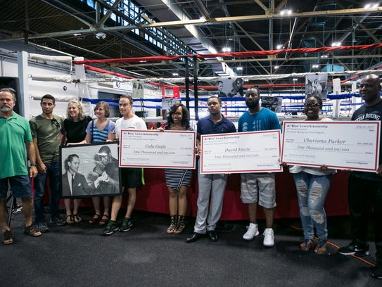 Scholarship recipients received their checks at a the