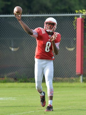 Louisville freshman quarterback Lamar Jackson goes through drills during practice at the Louisville football practice fields in Louisville, Ky., Sunday, Aug. 9,, 2015. (Timothy D. Easley/Special to the C-J)
