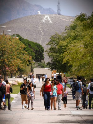Students walk along the International Mall on the first day of class instruction.