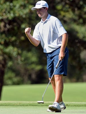 Simms Abney reacts to a birdie putt on 13 during day 2 of the AJGA David Toms Junior Invitational at Southern Trace Country Club. Abney leads through the second round at -6.