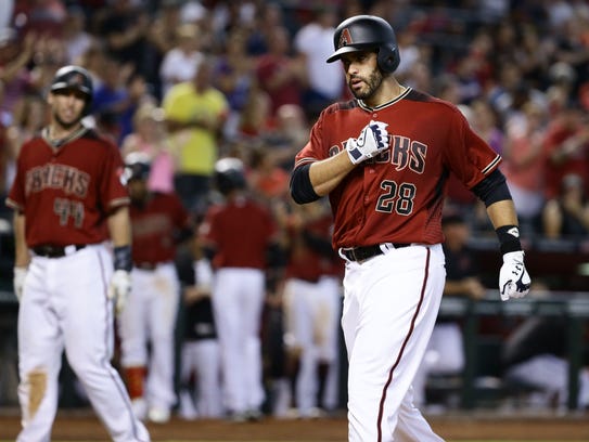 J.D. Martinez crosses home plate after belting a two-run