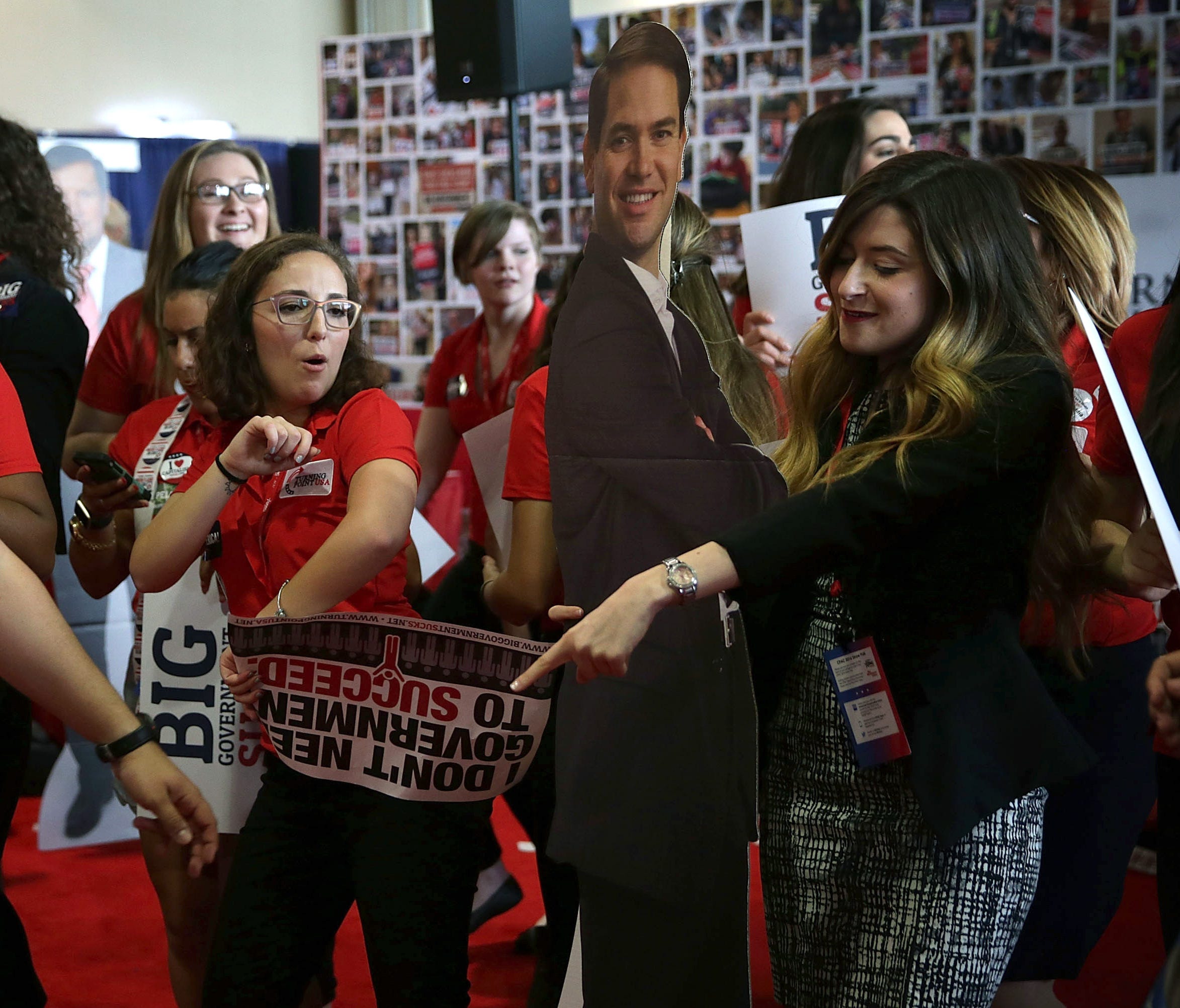 Members of Turning Point USA dance with a cardboard cutout of Republican presidential candidate Sen. Marco Rubio (R-FL) during the 2016 Conservative Political Action Conference (CPAC) in National Harbor, Maryland.