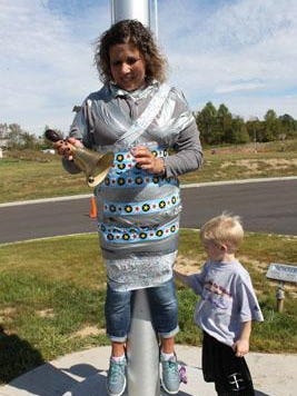 St. Timothy Preschool Principal Deb Thomas told the children if they raised enough money for school’s Walk-a-Thon, and convinced their teachers to donate, she would let them tape her to the flagpole. Students and teachers delivered, so out came the duct tape.