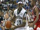 LeBron James drives the baseline on D.J. Strawberry