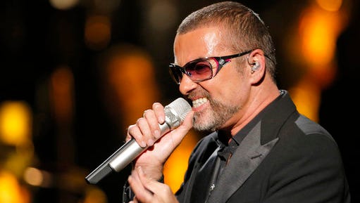 FILE - In this Sept. 9, 2012 file photo, British singer George Michael sings in concert to raise money for AIDS charity Sidaction, in Paris, France.  A private funeral took place Wednesday March 29, 2017, at Highgate Cemetery, north London, according to a statement released by Michael’s publicity agency, Connie Filippello Publicity, saying the funeral was attended by family and close friends.