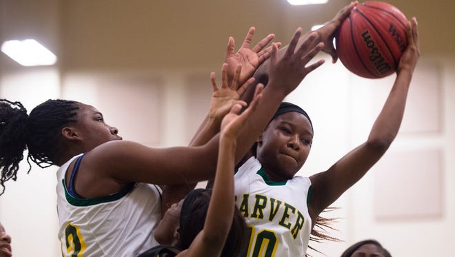 Carver's Shaonica Thomas (10) grabs a rebound during the basketball game on Friday, Feb. 12, 2016, in Montgomery, Ala.
