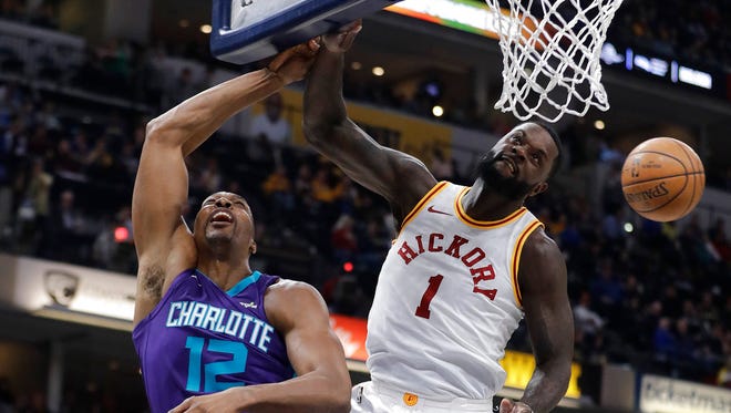 Indiana Pacers' Lance Stephenson (1) blocks the shot of Charlotte Hornets' Dwight Howard during the first half of an NBA basketball game Tuesday, April 10, 2018, in Indianapolis.