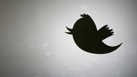 The Twitter logo is displayed at the entrance of Twitter headquarters in San Francisco.