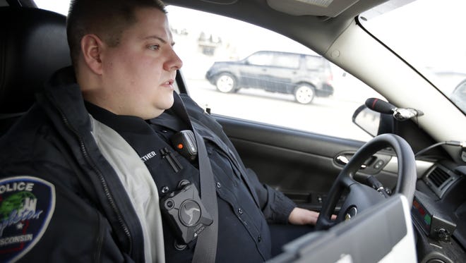 Sean Kuether, a community liaison officer with the Appleton Police Department, drives while on patrol Jan. 24 in Appleton. Kuether heads the department's Law Enforcement Addiction Assistance Program.