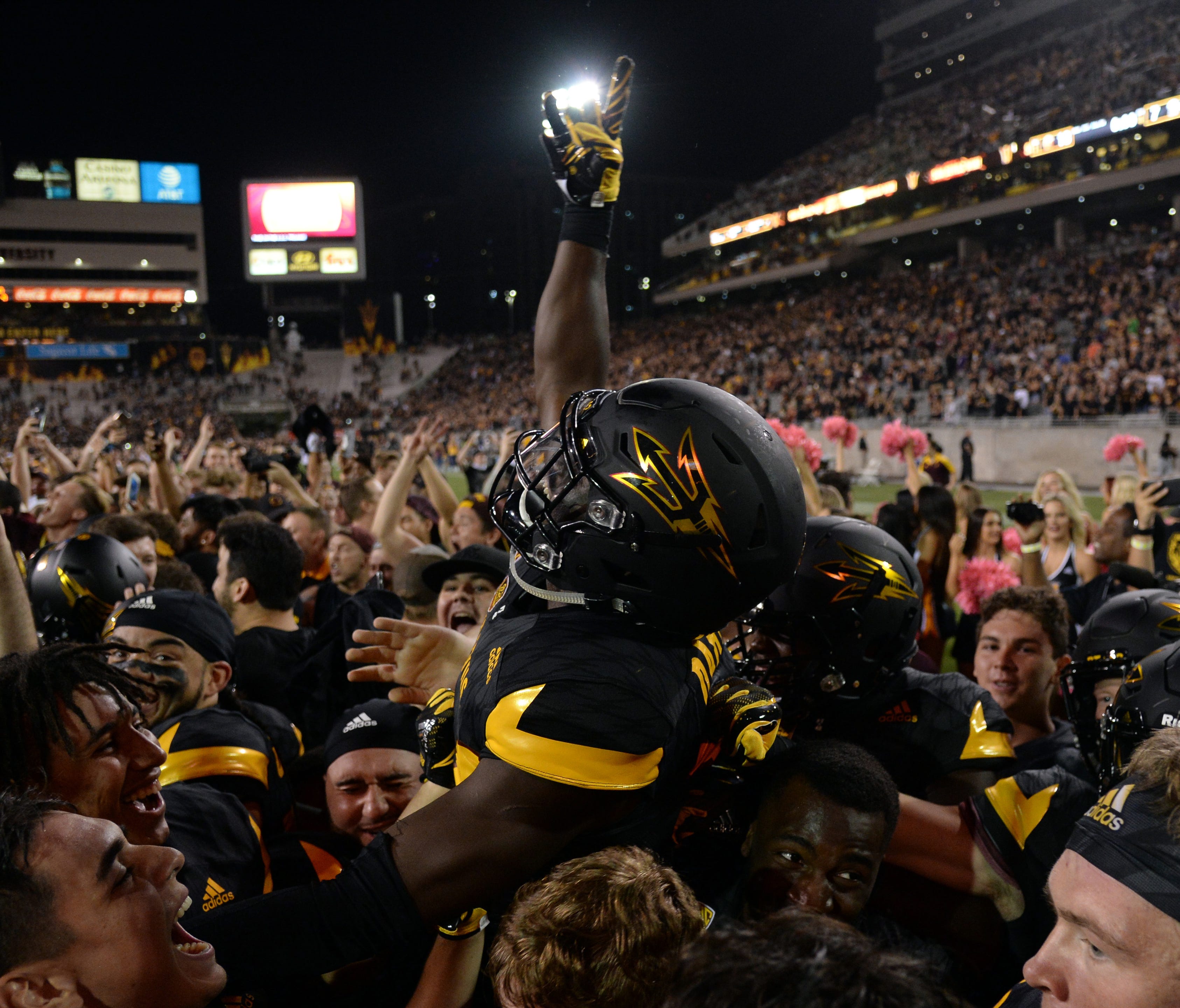 Arizona State players and fans celebrate after the Sun Devils upset win over Washington.