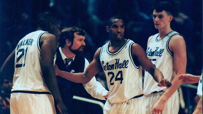 Seton Hall's Terry Dehere (24) meets with his team during a game in 1993.