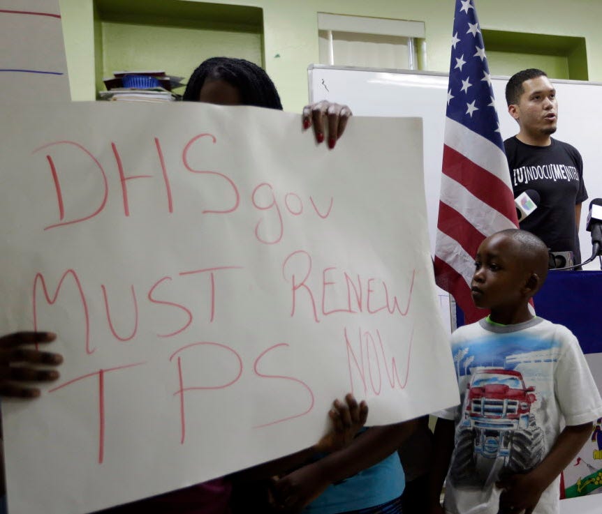 Julio Calderon, 28, upper right, an undocumented immigrant from Honduras, speaks in favor of renewing Temporary Protected Status (TPS) for immigrants from Central America and Haiti now living in the United States, during a news conference Monday, Nov