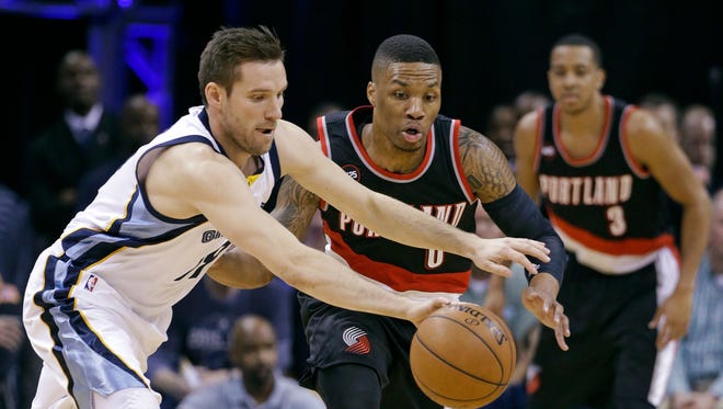 Memphis Grizzlies guard Beno Udrih, left, of Slovenia, chases after the ball with Portland Trail Blazers guard Damian Lillard (0) in the first half of Game 5 of an NBA basketball playoff series Wednesday, April 29, 2015, in Memphis, Tenn.