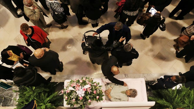 A mourner paid respect to civil rights leader and former Kentucky State Sen. Georgia Davis Powers as she was remembered in the Capitol rotunda in Frankfort.