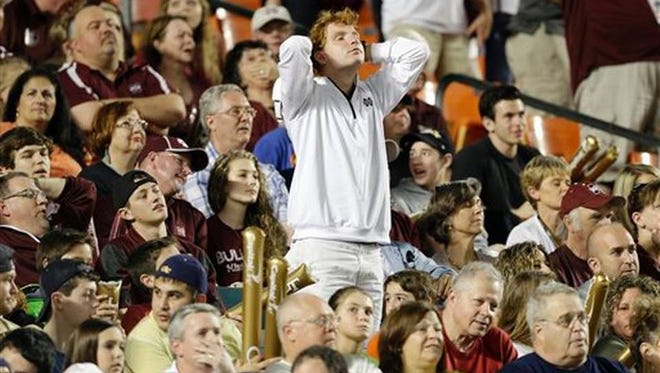 Mississippi State fans watch the Orange Bowl with displeasure on Dec. 31, 2014.