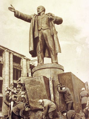 ADV. FOR SUN., JAN. 17--FILE--This is a 1946 file picture by Georgy Lugovoi, showing municipal workers erecting a monument to Vladimir Lenin in St. Petersburg, Russia. Lugovoy was born April 27, 1900 and lived most of his life in St. Petersburg, where he worked as a photographer. Lugovoi witnessed the 1917 Russian revolution, the Nazi siege of the city during W.W.II, and all the other tumultuous events that have rocked Russia this century. (AP Photo/Georgy Lugovoi)