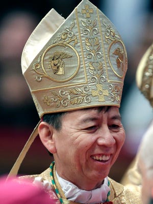 Archbishop Savio Tai Fai Hon is congratulated after Pope Benedict XVI ordained him in 2011 a ceremony in St. Peter's Basilica at the Vatican.
