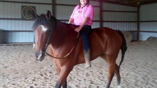 
Brianna Brown enjoys a bareback ride on Tucker during horse camp at Circle D Farm in Bridgeton.

