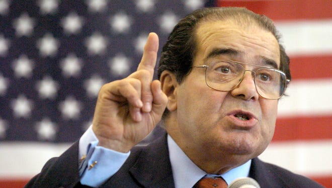 In this Wednesday, April 7, 2004, file photo, U.S. Supreme Court Justice Antonin Scalia speaks to Presbyterian Christian High School students in Hattiesburg, Miss. On Saturday, Feb. 13, 2016, the U.S. Marshals Service confirmed that Scalia has died at the age of 79.