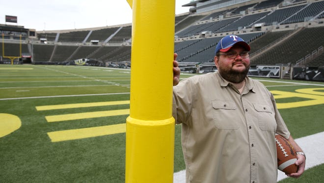 Statesman Journal reporter Pete Martini pauses for a photo at Autzen Stadium on Friday, July 10, 2015, in Eugene.