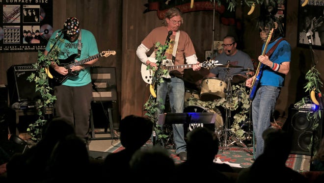 Steven Swift, Brian Hoover, Dennis Green and Chuck Triplett of Bottled Monkey perform on Feb. 6, 2015, at Groovacious in Cedar City. The band will reunite on April 2 to play a benefit concert for Groovacious owner Lisa Cretsinger following the death of her husband, Tim.