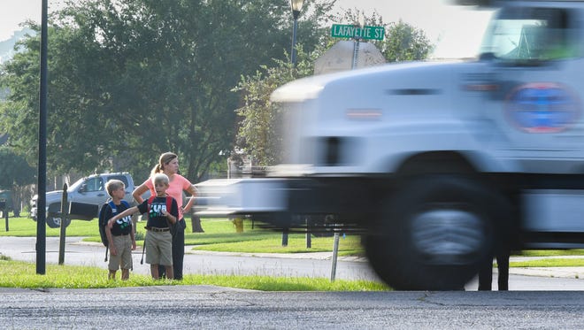 Students wait for bus on first day of school on hwy. 89 in Youngsville, LA. Wednesday, Aug. 9, 2017.