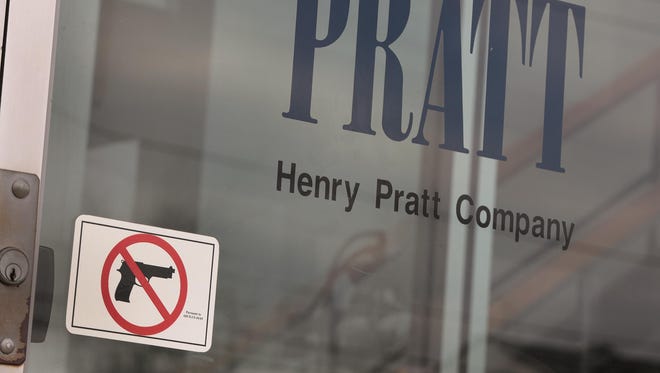 The man who opened fire and killed five co-workers including the plant manager, human resources manager and an intern working his first day at a suburban Chicago manufacturing warehouse, took a gun he wasn’t supposed to have to a job he was about to lose.