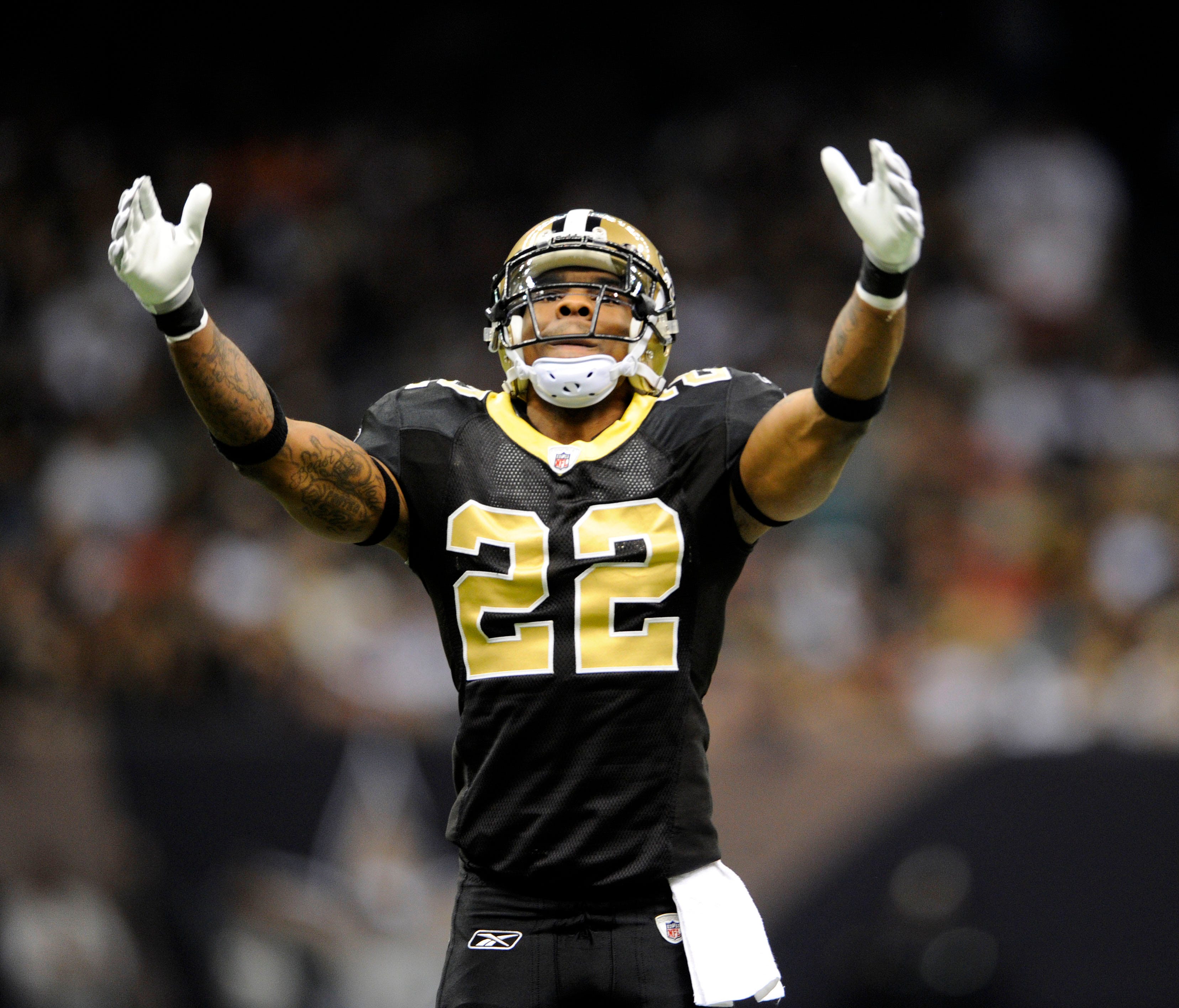 New Orleans, LA, USA;  New Orleans Saints cornerback Tracy Porter (22) pumps up the crowd to make noise against the Tampa Bay Buccaneers during the second quarter at the Louisiana Superdome.