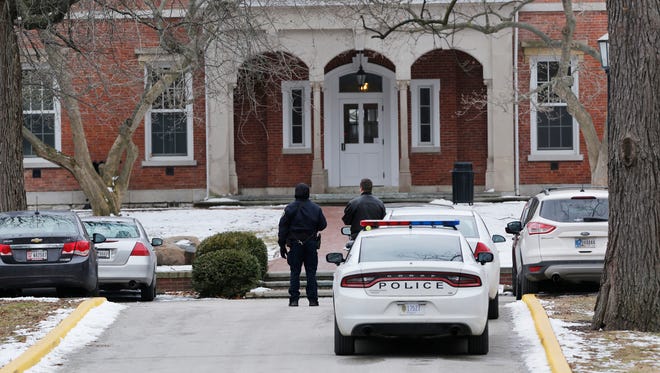 Police cars line streets on campus Wednesday, February 17, 2016, at Wabash College in Crawfordsville. The campus had been placed on lockdown following a double homicide near Zionsville. A Wabash College employee is a suspect in the homicides. The lockdown was lifted around 3 p.m.