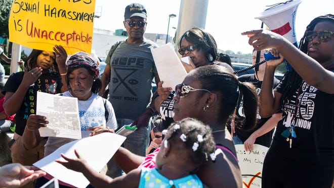 October 6, 2016 - Dunetra Merritt, center, speaks through a megaphone to a group gathering outsides of McDonald's in the 900 block of Union to protest sexual harassment in the workplace. "Sexual harassment on the job is not fair," Merritt said. "A lot of people are afraid of losing their jobs or having their hours cut if they speak out. Let your voice be heard and know that people are listening."