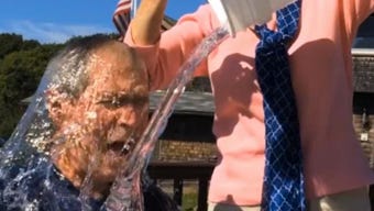 In this image from video posted on Facebook, courtesy of the George W. Bush Presidential Center, former President George W. Bush participates in the ice bucket challenge with the help of his wife, Laura Bush, in Kennebunkport, Maine.