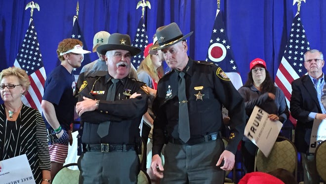 Republican Butler County Sheriff Richard Jones (left) talks to Democratic Hamilton County Sheriff Jim Neil at a Trump rally in West Chester in March 2016. Jones supports Trump, while Neil later said he only felt Trump was the best in the GOP field.