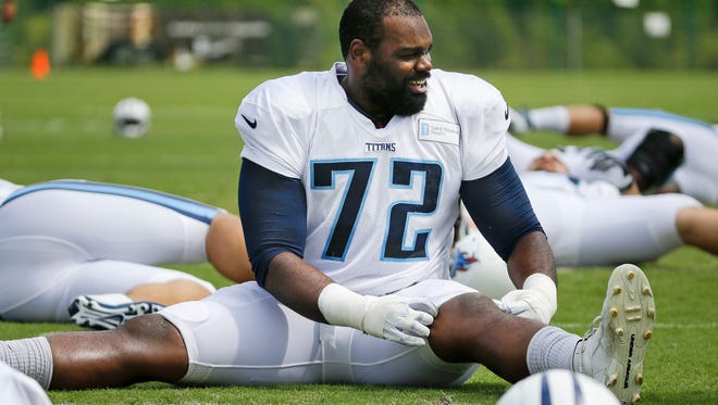 FILE - In this Aug. 1, 2014, file photo, Tennessee Titans tackle Michael Oher (72) warms up during NFL football training camp in Nashville, Tenn. The last time Oher played in New Orleans, he was a starting tackle for the Super Bowl champion Ravens. He returns less than two years later on Friday night, Aug. 15, 2014, for a preseason game with the Titans, trying to prove he's remains worthy of a starting job in the NFL. (AP Photo/Mark Humphrey, File)
