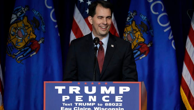 Wisconsin Gov. Scott Walker campaigns for Republican presidential candidate Donald Trump during a campaign rally at the University of Wisconsin Eau Claire, Tuesday, Nov. 1, 2016, in Eau Claire, Wis.