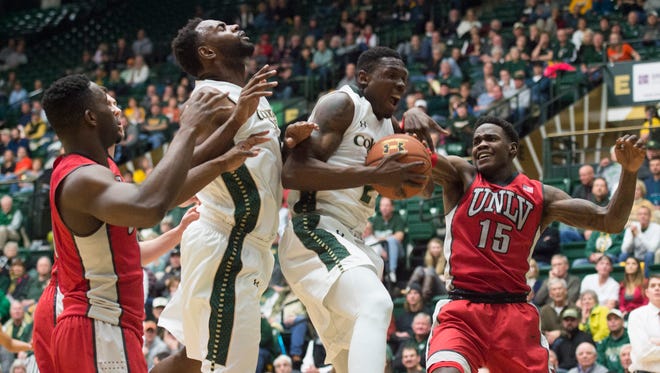 Emmanuel Omogbo of CSU holds on tight to the ball after rebounding the ball in a game against UNLV at Moby Arena Wednesday, January 6, 2016. CSU can still finish with the Nos. 6, 7, 8 or 9 seeds in the Mountain West tournament.