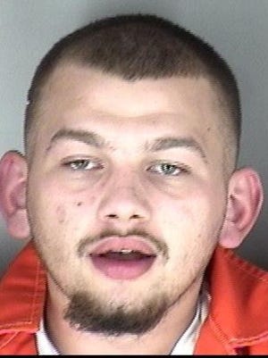 Jacob Isaiah Reisinger, 20, was being held Thursday in the Shawnee County Jail in connection with crimes that included aggravated robbery and aggravated battery.