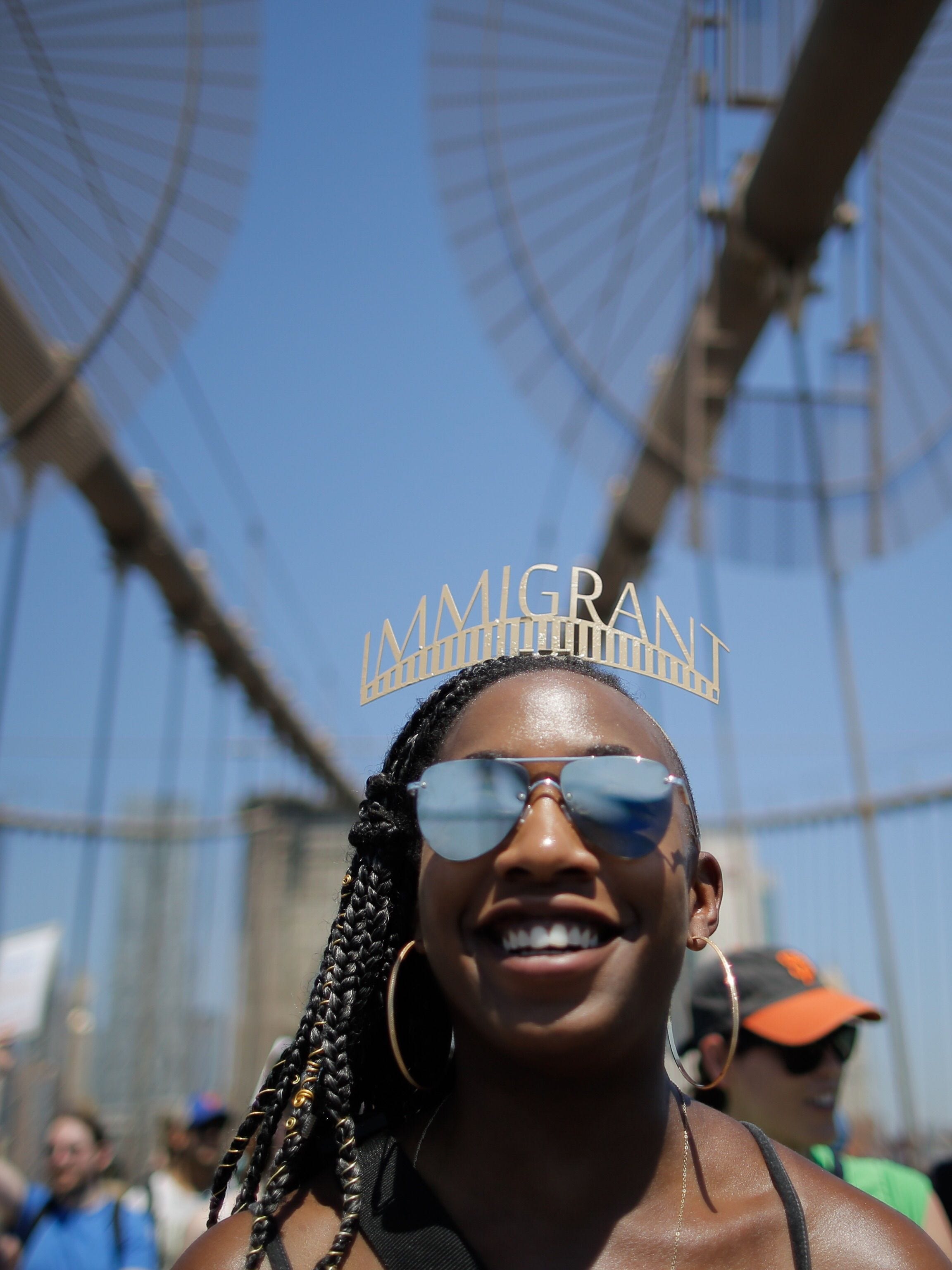 Demonstrators cross the Brooklyn Bridge as they march