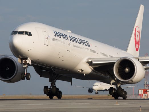 A Japan Airlines Boeing 777 nearing from Tokyo lands