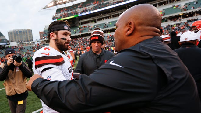 Cleveland Browns quarterback Baker Mayfield (6) meets with Cincinnati Bengals special assistant Hue Jackson, right, after an NFL football game, Sunday, Nov. 25, 2018, in Cincinnati. (AP Photo/Frank Victores) ORG XMIT: OHJMOTK