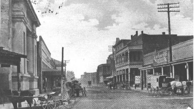 Main Street Lafayette in 1914. The 1859 Lafayette Parish Courthouse is on left.