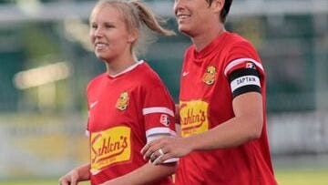 Courtney Wagner, left, was an honorary captain for the Western New York Flash women's soccer team, which included Pittsford's Abby Wambach, during the 2014 season.