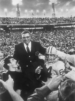 Green Bay Packers coach Vince Lombardi is carried off the field Jan. 14, 1968 after his team defeated the Oakland Raiders 33 to 14 in Super Bowl II, in Miami, Fla.  Packers guard Jerry Kramer (64) provides one of the shoulders for Lombardi's ride.