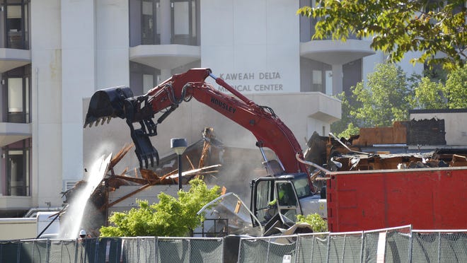 Demolition begins Tuesday on two medical buildings near Kaweah Delta Medical Center.