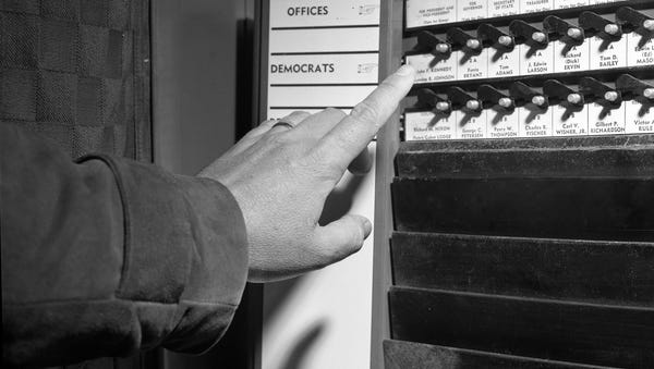 Close-up view showing decision for president being made at a voting machine in Tallahassee.