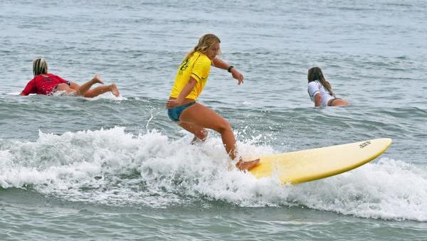   Lauren McLean competing in a prp women's longboard heat. Sunday at the NKF  (National Kidney Foundation) Rich Salick Pro-Am Surf Festival at the Cocoa Beach Pier.