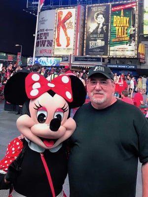 Taking a picture with Minnie Mouse was all part of the tourist experience for columnist Joe Phalon.