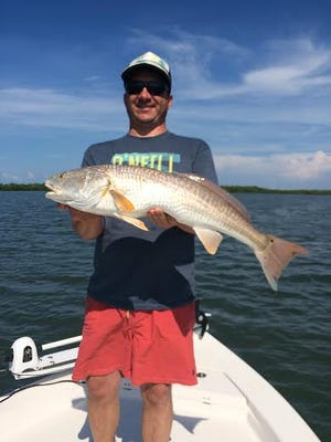 Jessie Aney's over-slot redfish was caught on an oyster bar south of Davis Key in Estero Bay on a freelined pinfish. He was fishing with Estero River Outfitters Capt. Matt DeAngelis.