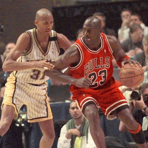 Chicago Bulls' Michael Jordan, right, tries to wor
