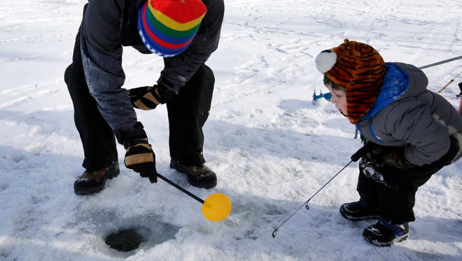 On a comfortable winter weekend with no Packers to watch, people were thinking about trout fishing, making snowmen inside and playing in the snow and on the ice, Saturday, January 23, 2016.Ron Page/Post-Crescent Media